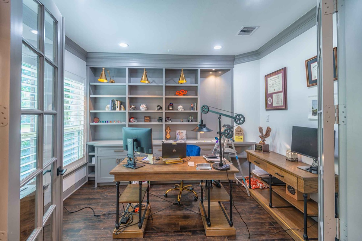 Custom home office with built-in shelving and cabinetry by Crafted Kitchens Houston