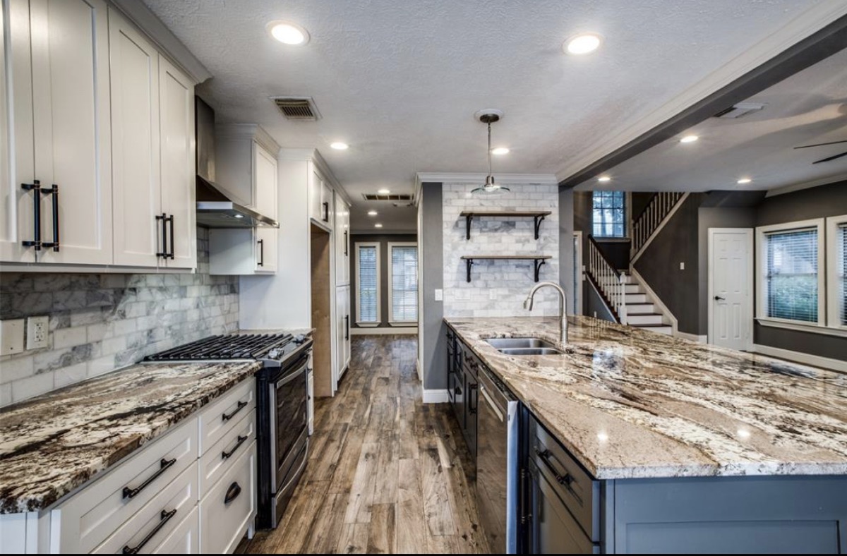 Kitchen renovation with granite countertops and marble backsplash in Houston