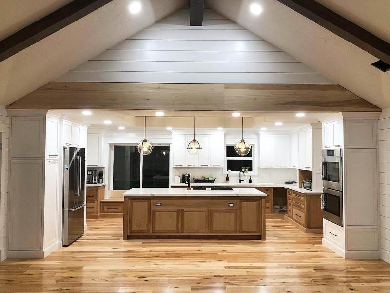 Vaulted ceiling kitchen remodel with shiplap and two-tone cabinetry in Houston